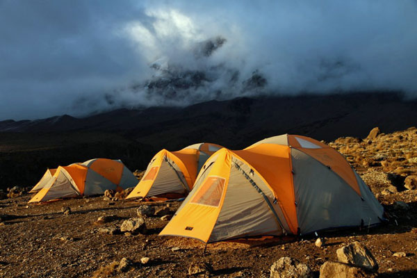 Kili-camp-tent-mist-sunset-SummitsAfrica