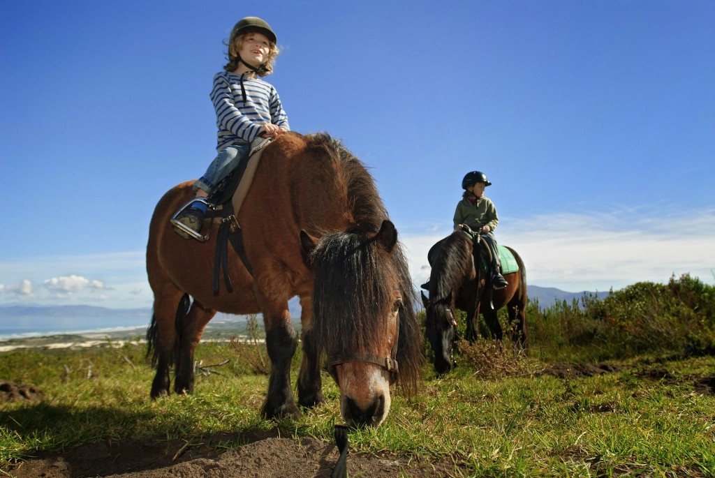 children riding ponies by the sea, Grootbos Riding, Garden Route, South Africa