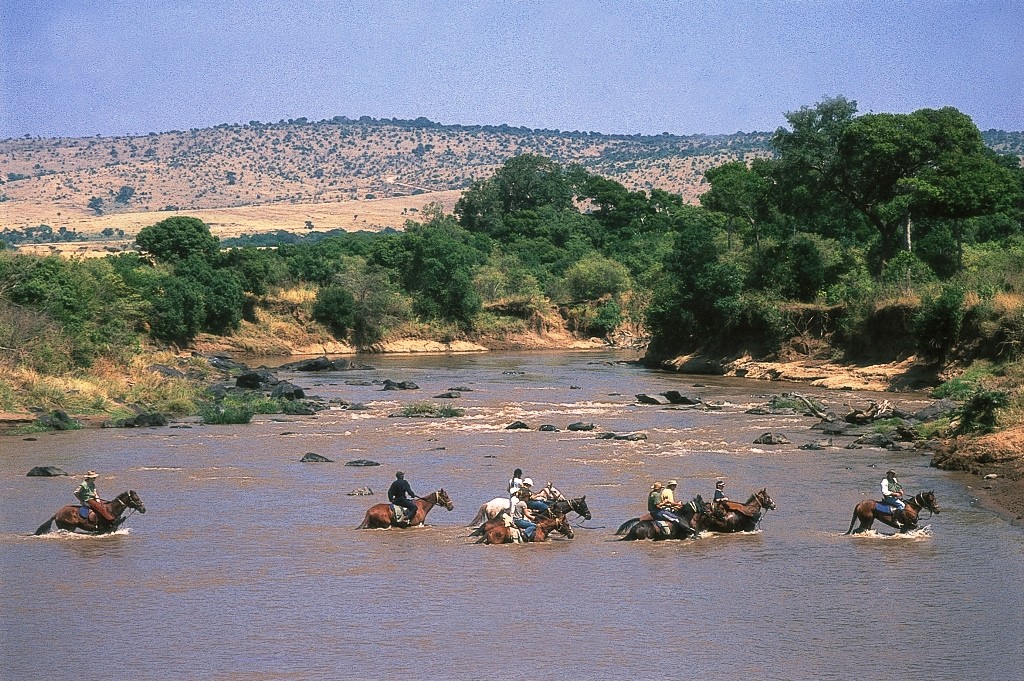A river crossing convoyof riders, Offbeat Riding Safaris, Kenya