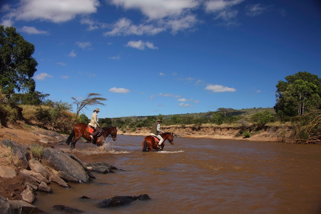 Hippos and riders in the river, Kenya, Safaris Unlimited riding safari holiday
