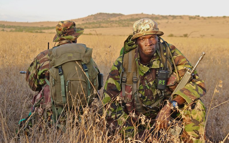 Camouflaged rangers on guard to protect rhino