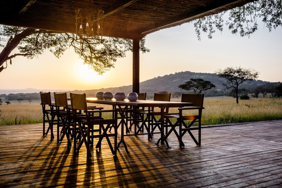 Sunrise The dinner table is the heart of the home at Singita Serengeti House, Serengeti, Tanzania