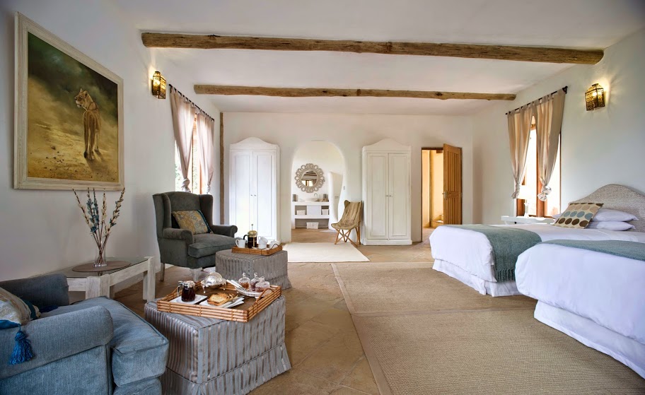 Cool, calm and contemporary bedroom white suites at Cottar's Private Homestead, Masai Mara, Kenya
