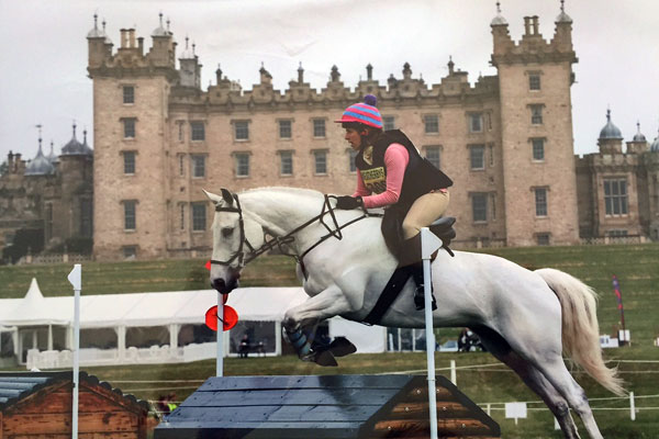Alice competing on horse (grey thoroughbred) Floyd at Floors Castle, Scotland