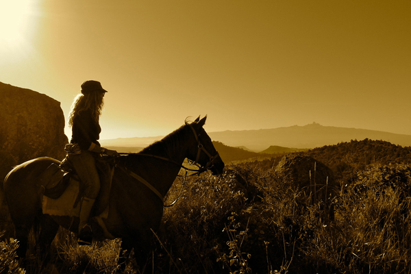Nicky Dyer riding guide on horseback at Borana Lodge Kenya