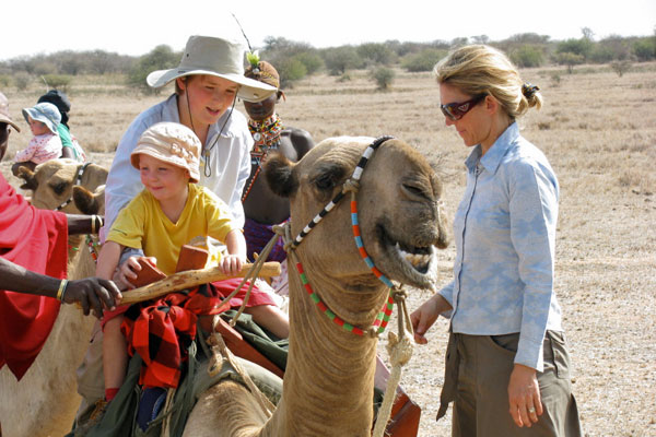 Children on camels at Karisia Walking Safaris, Kenya, with owner Kerry Glen