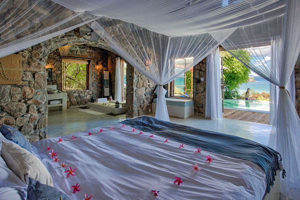 Kaya Mawa bedroom suite overlooking pool and Lake Malawi