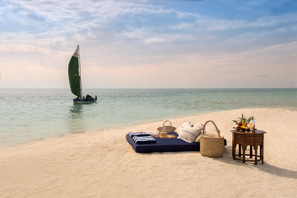 Benguerra Island, Mozambique - dhow sailing boat and beach picnic on a sandspit