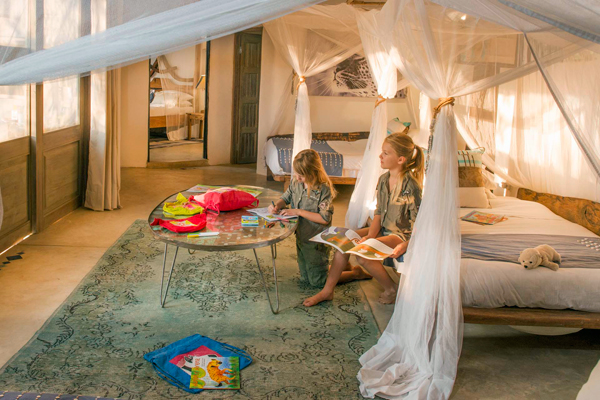 Kaingo Camp, two female children in bedroom suite family safari camps in Zambia