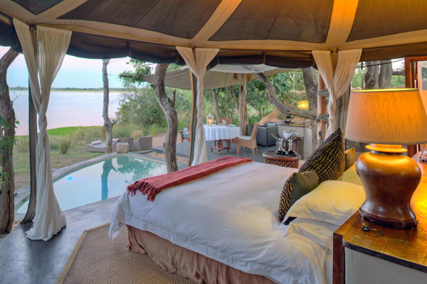 Tented chalets with en-suite facilities and private verandah overlooking the river, Time + Tide Chonge River Camp