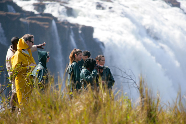 Victoria Falls family visiting in waterproofs family safari experiences 