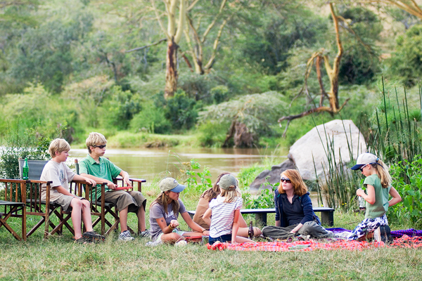Family picnic by the river at Sosian, Laikipia, Kenya