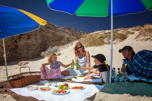 Family picnic on a Garden Route beach, Grootbos