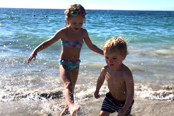 Bella and George playing on the beach, credit Rosanna Pile