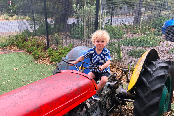 George on a tractor at the children's play area at Noordhoek Farm Village