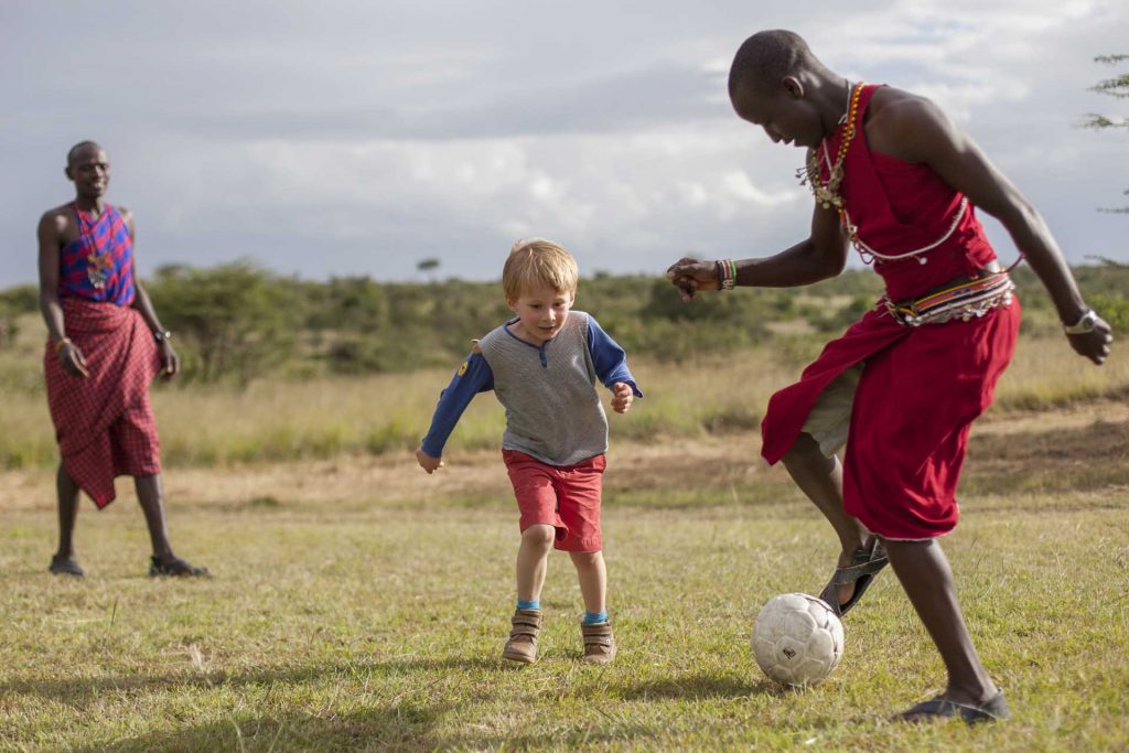 active family safaris. Football with the guides at Encounter Mara Camp, Masai Mara, Kenya